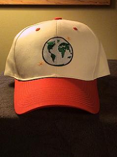 WHITE BASEBALL STYLE CAP WITH RED BILL, PICTURE OF EARTH STITCH ON FRONT AND WWW.EARTHBATTALION.COM ON THE BACK.