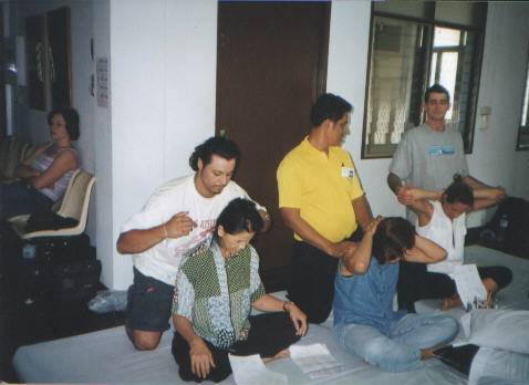 Joseph, John, and Lois in massage school