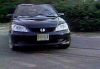 Video shows the car swerved away at the last second before hitting a WMGM-40 photographer. (Courtesy WCAU-TV)