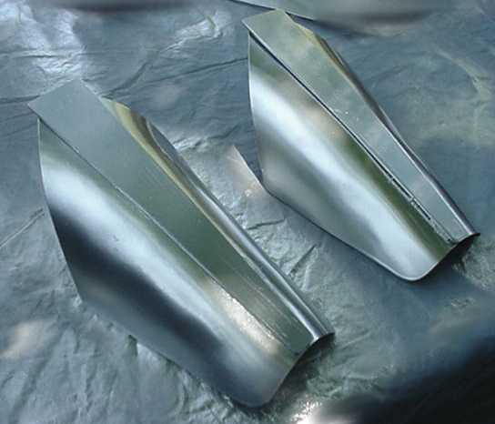 A pair of finished shin pieces.