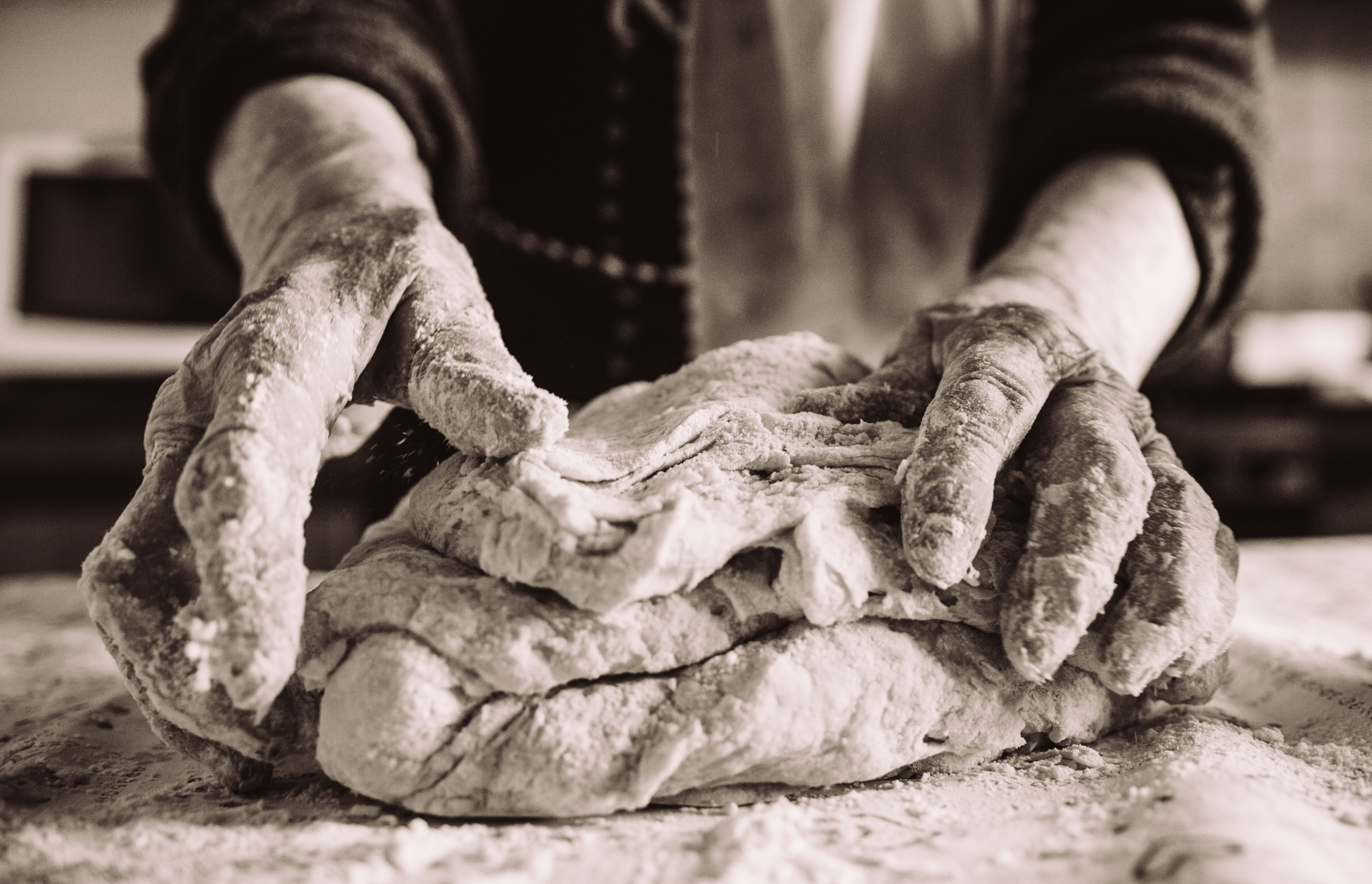 Hands kneading dough