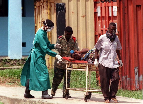 Hospital workers transporting ebola victim