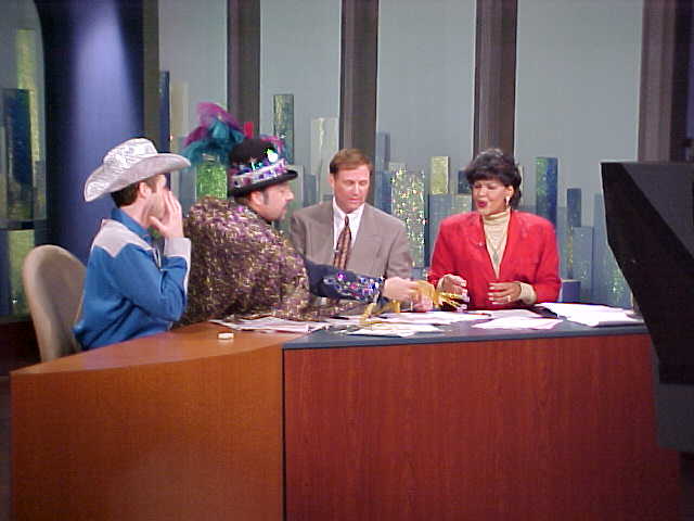 From left-David Bernard, meteorologist, Edward R., and WWL-TV 4 anchors Eric Paulsen and Sally-Ann Roberts