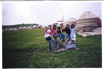 Friends on the grassland and tent-hotel in Mongolian style