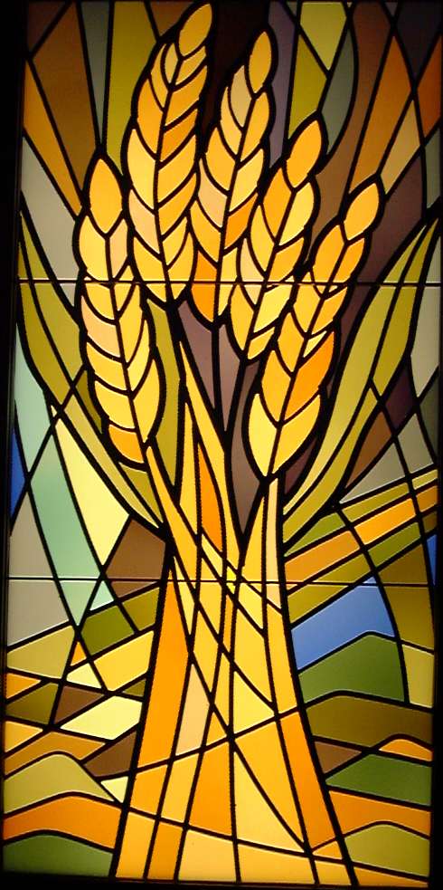 Stained glass window showing sheaf of wheat