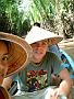 Isabel and I on a boat wearing the classical Vietnamese conical hats.