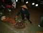 A Vietnamese woman selling her goods on the street