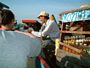 A deal is struck! The floating market on the Mekon river
