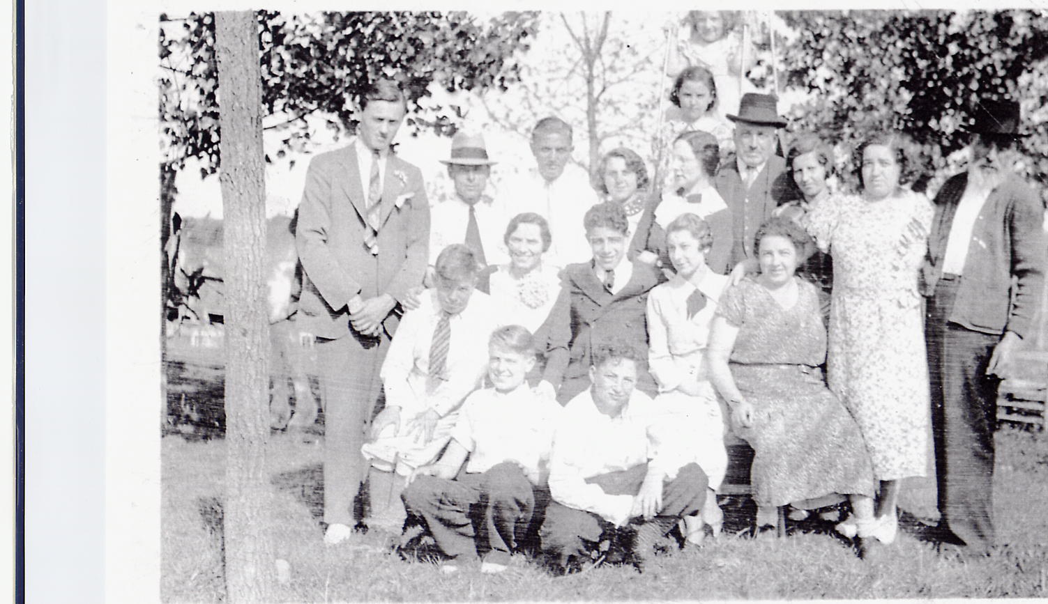 A GELB FAMILY GATHERING, POSSIBLY AT THE GELB BROTHERS KOSHER HOTEL, THE LAKE VIEW HOUSE, IN ELLENVILLE, NEW YORK. HENRY GELB IS 2ND FROM THE LEFT. HIS UNCLE JOSEPH GELB WORE A HAT, TOWARDS THE MIDDLE OF THE PICTURE. JOSEPHS DAUGHTER, TILLIE, IS THE LAST ONE SEATED ON THE RIGHT. ELIAS, HENRYS FATHER, IS ON THE FAR RIGHT. TILLIES BROTHER, GUSSIE PRINCE, IS THE 2ND FROM THE RIGHT. TILLIES SON, ARTHUR, IS KNEELING IN THE CENTER. PLEASE HELP TO IDENTIFY EVERYONE ELSE IN THIS PICTURE.