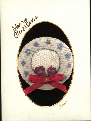 "little bitty hat" decorated in forget me nots and flowering crab buds, topped off with a little red ribbon