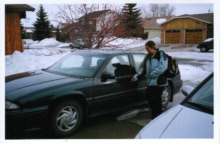 This is my new car. Its virtually the same as the old one.. It's one year newer, has 4 doors, and had about the same milage. Also pictured is Pip, my fiancee, whom I'm glad wasn't my passenger that night.