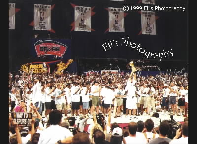 Tim Duncan holding 1999 NBA Champs trophy