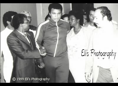 Ali shaking hands w/ people