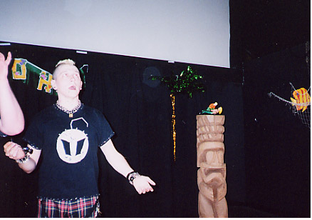 Look out, Neo-Aquaman!  That giant punk comic-shop geek is about to sing!  switch to roll-mode!