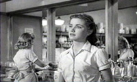 Nellie (Dolores Hart) watches Danny (Elvis) sing Lover Doll