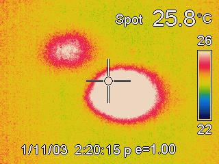Infrared image of the landing spots of two shot 
puts.  The one on the lower right is the most recent of the two.