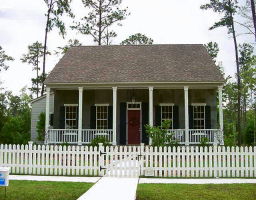 Is this a dollhouse? NO, it's a cute home in Covington, LA....complete with white picket fence!