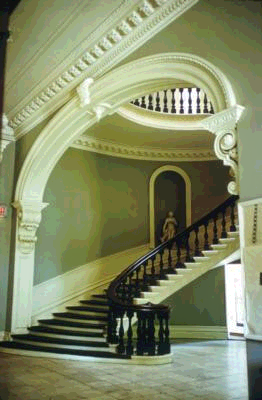 Stairs at my daughter's school (Louise McGehee School for Girls)...no kidding.&nbsp; Look at the detail in the molding that surrounds the door and ceiling.