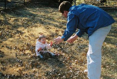 Sean tried to get Emma to throw the leaves in the air... not really successful there since Emma didn't want to really touch the leaves.