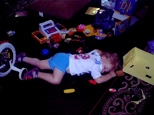 So much fun, she collapsed among her new toys.