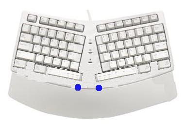 "natural" type keyboard, without arrow keys or number pad, and dual analog thumb controls