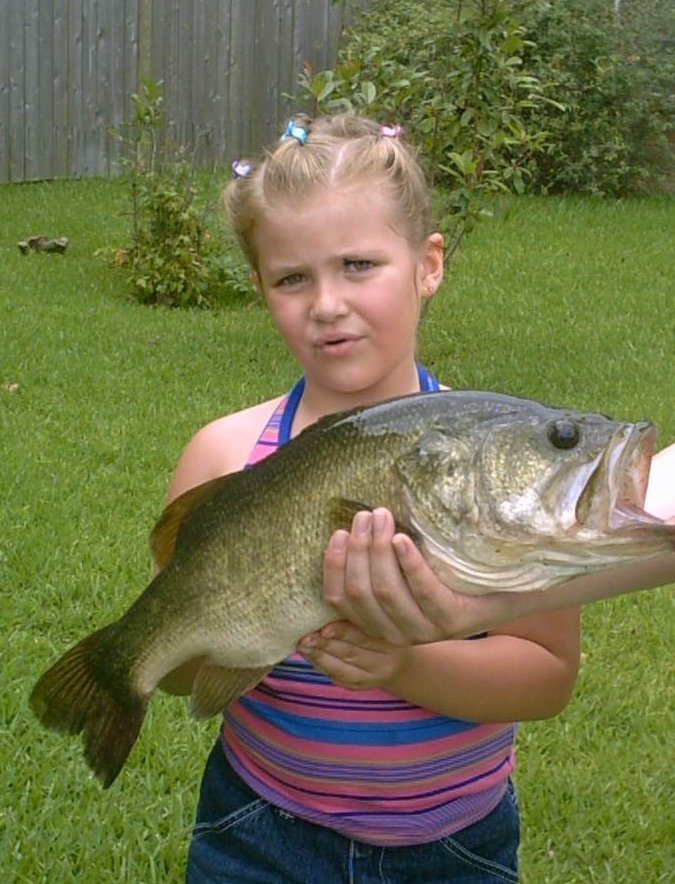 Alexis with a fish she caught on a scooby doo pole