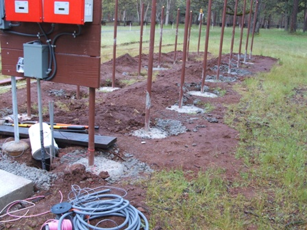 There are 18 posts of 2 in pipe set into 7 yards of concrete. Whew!!