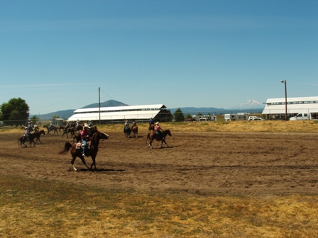 Some of the riders warming up before competition at the Intermountain Fairgrounds.&nbsp; Mt Shasta in the background!