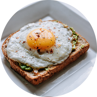 Toast with Avocado and Sunny Side Up Egg