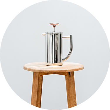 French Press Sitting on a Wooden Stool