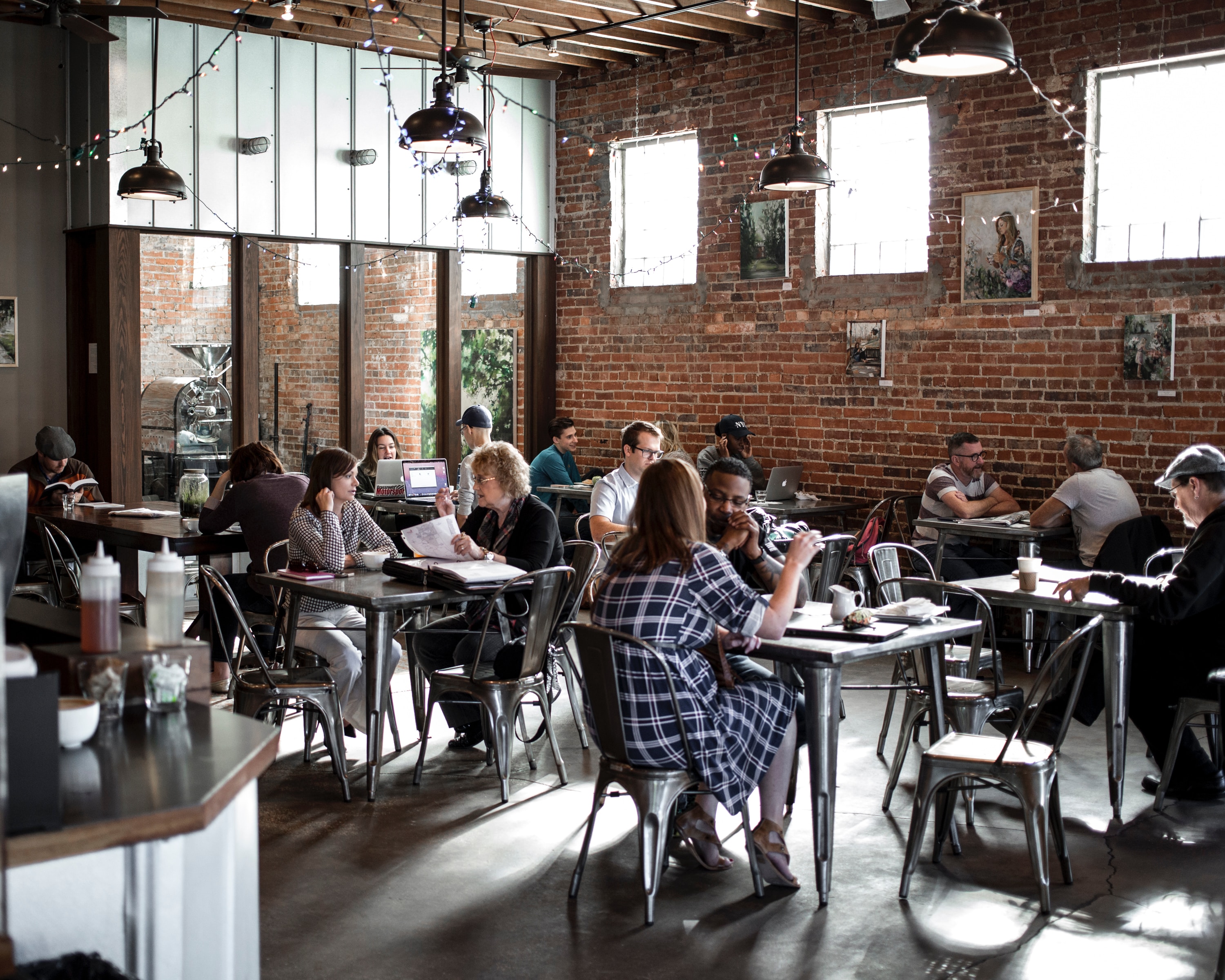 Cafe full of Customers Sitting at Tables