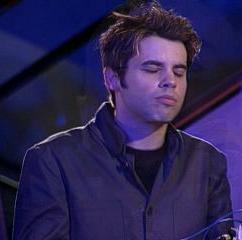 Looking very solemn during "Thrive"