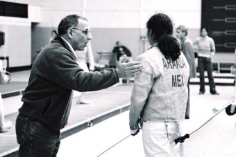 photo of Ariana with Coach Charles Randall during 1 minute rest break, Ariana wins her first individual gold medal
