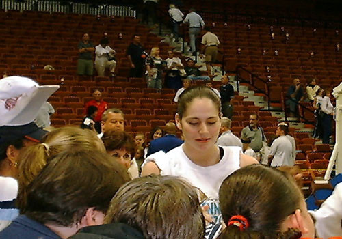 Sue Bird is signing autograph after the game