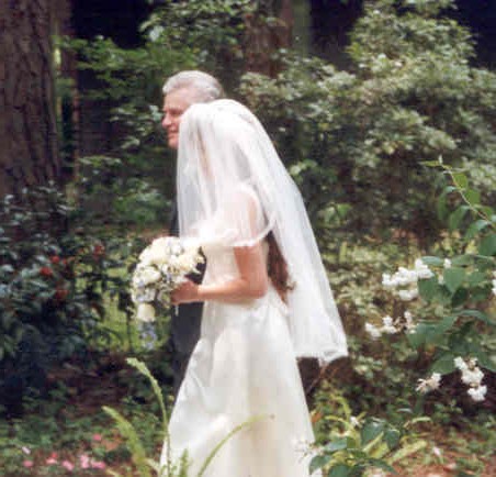 Dad walking Kelly down the aisle