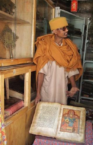  Monk with a centuries-old holy book - Kebran Gabriel monastery 
