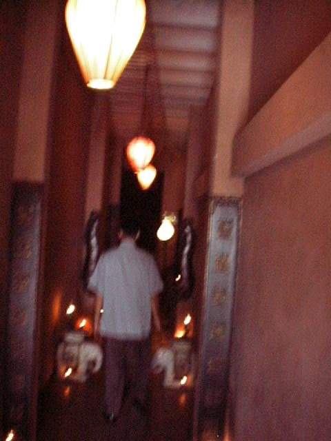 Dark, candle-lit entrance.