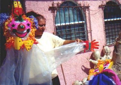 A pinata maker at her home
