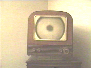 THE SPOT IN THE MIDDLE OF THE SCREEN IS WHAT CAN HAPPEN WHEN SOME IDIOT BREAKS THE PICTURE TUBE