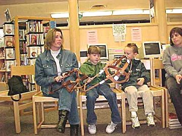 Audience members examine a
Seeing Eye Dog Harness