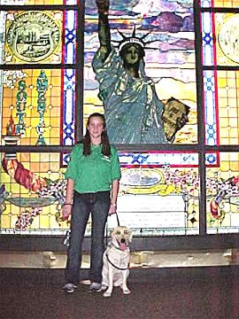 Kim and her puppu in front of
the Stained Glass Window of the
Statue of Liberty