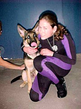 Puppy Sirius gets a hug
from a Dolphin Trainer