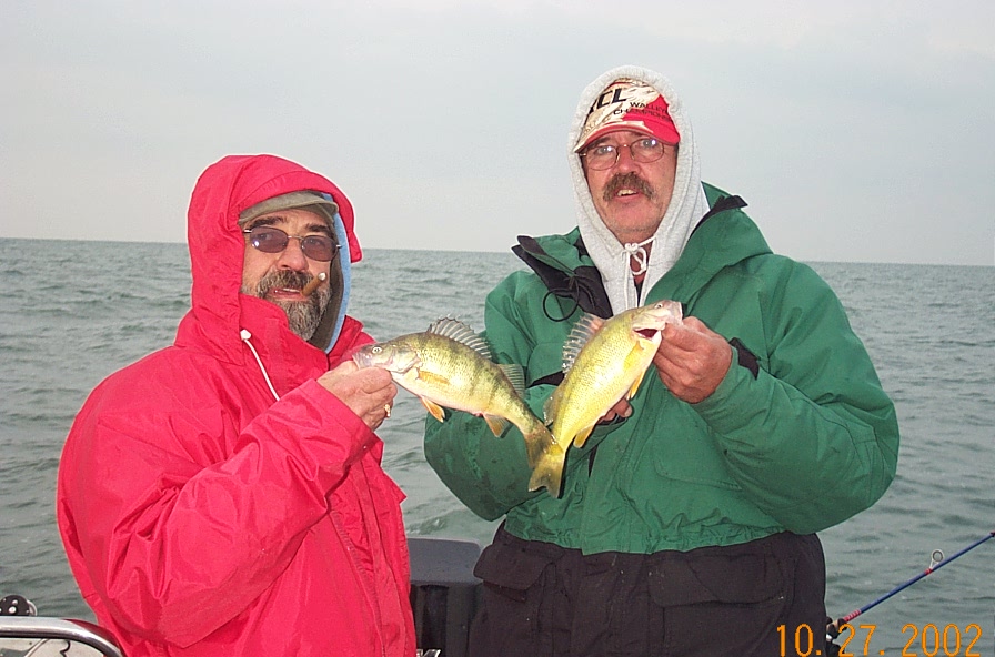 My brother in law Jason (kinda) with a couple perch we caught