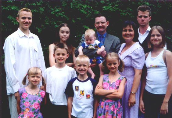 front: Elizabeth/second row: Rachel, Daniel, and Stephen/third row: Rebecca, Sarah, Barb, Andy/back: Allen, Pastor Dave