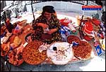 Steamed groundnuts vendor @ local market