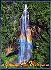 Spectacular rainbow of the 150m high Mount Tapis Waterfall
