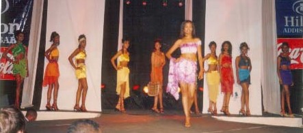 An elegant Mustafa Hassanali creation, Beach wear On Atetegeb And Finalists in Background    