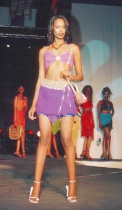 An elegant Mustafa Hassanali creation, Beachwear Modeled by one of the semi Finalists   