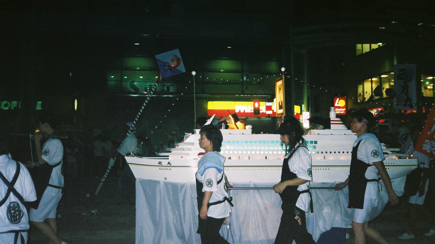 ...which isn`t the sombre affair you might think.&nbsp; This is a model boat being paraded through the street.&nbsp; After some incredibly loud fireworks and fire crackers, paper boats and lanterns are floated out to sea.&nbsp; For a while.&nbsp; Then they are promptly and efficently crushed in a compactor.