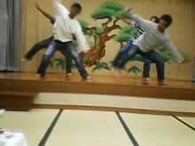The teachers from Higashi perform a "fishing dance" thingy at an enkai (party)